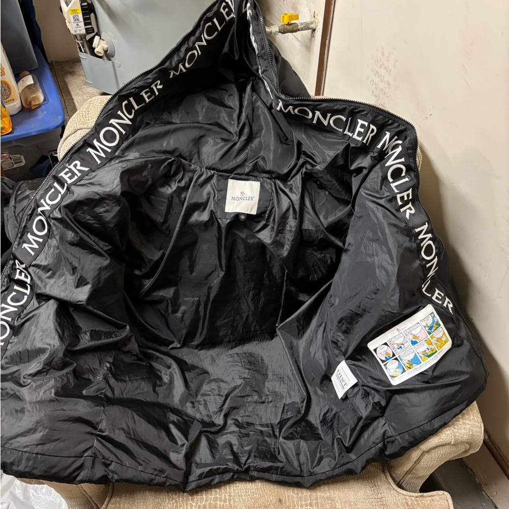 Moncler Black Quilted Jacket with Comic Detail